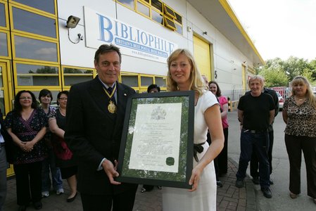 Bob Hall, President of the Royal Warrant Holders' Association presents us with our calligraphy on parchment Royal Warrant 2011. / {Location}: Datapoint\\n\\n22/05/2012 14:49